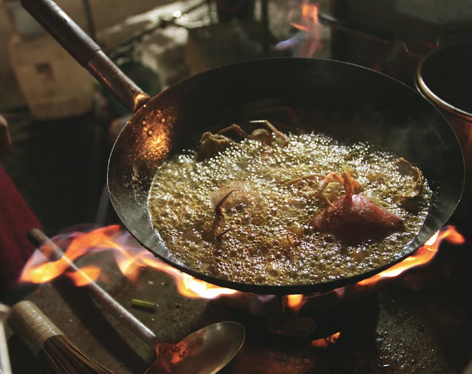 Saffron House preview: a 3D copper karahi of chicken cooking over charcoal